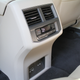 The 115-volt plug is under a trapdoor next to the two USB plugs on the back of the console.